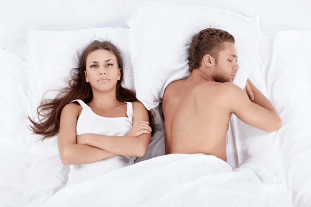 a woman in bed with a man of poor potency