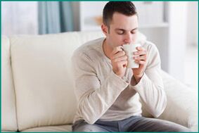 A man drinks peppermint tea to cure erectile dysfunction. 